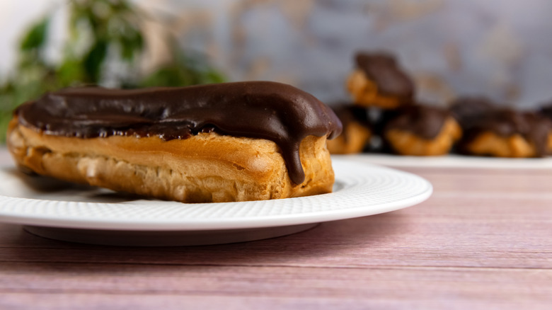 Chocolate eclair on plate