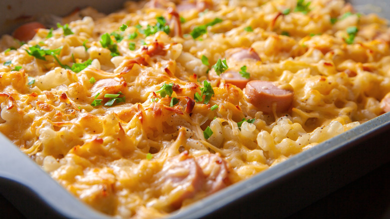 A cheesy baked pasta dish with sausage