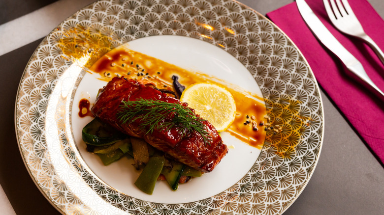 glazed salmon fillet with sesame close-up on plate