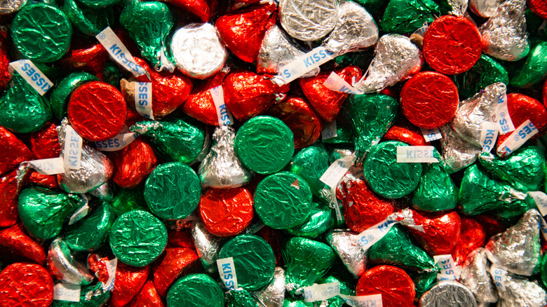 Red, green, and silver wrapped Hershey Kisses.