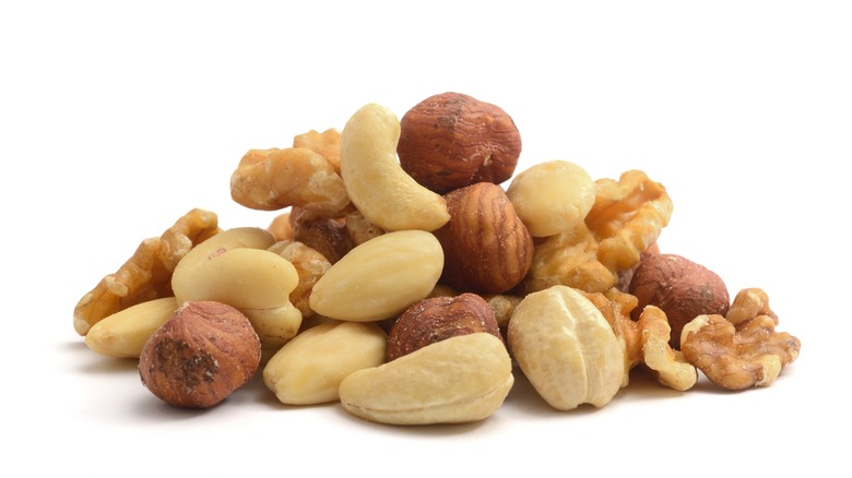 A variety of nuts on a white background.