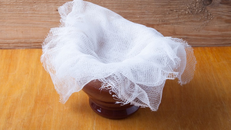 Layered cheesecloth over a bowl