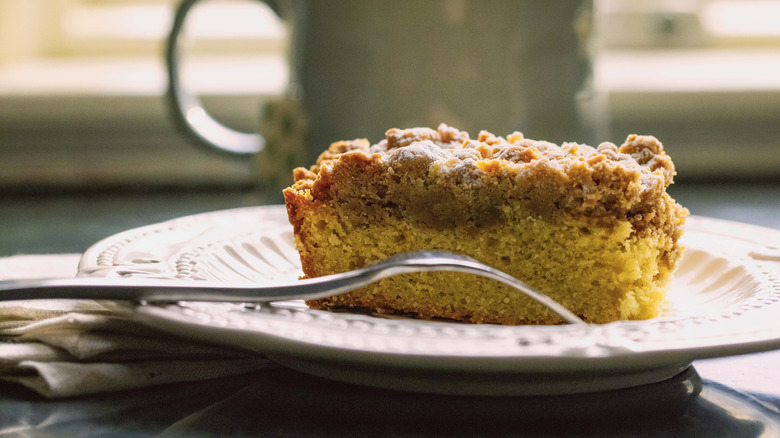 Coffee cake next to a hot coffee