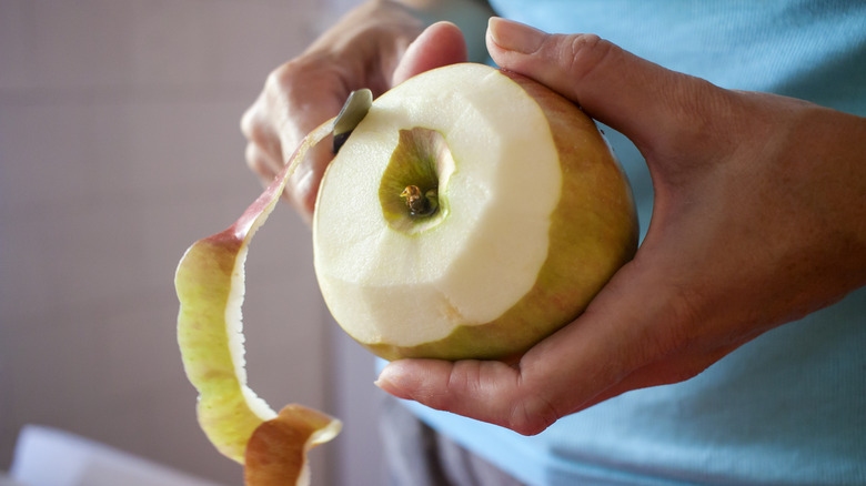 apple being peeled