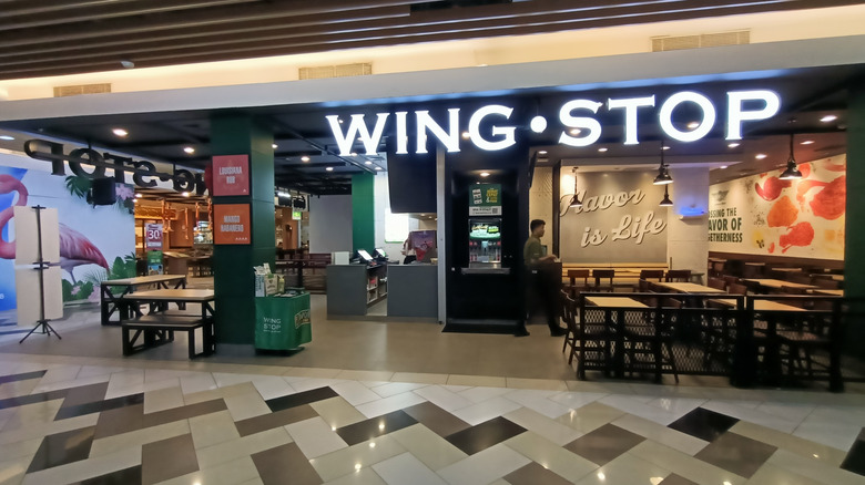 A Wingstop restaurant inside of a shopping mall
