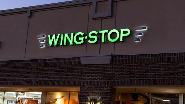 A Wingstop restaurant exterior at night