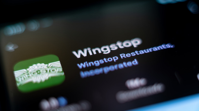 A close-up photo of the Wingstop mobile food delivery app