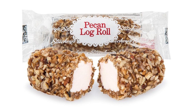 Two Stuckey's Pecan Log Rolls, one in a package and the other plain and broken in half.
