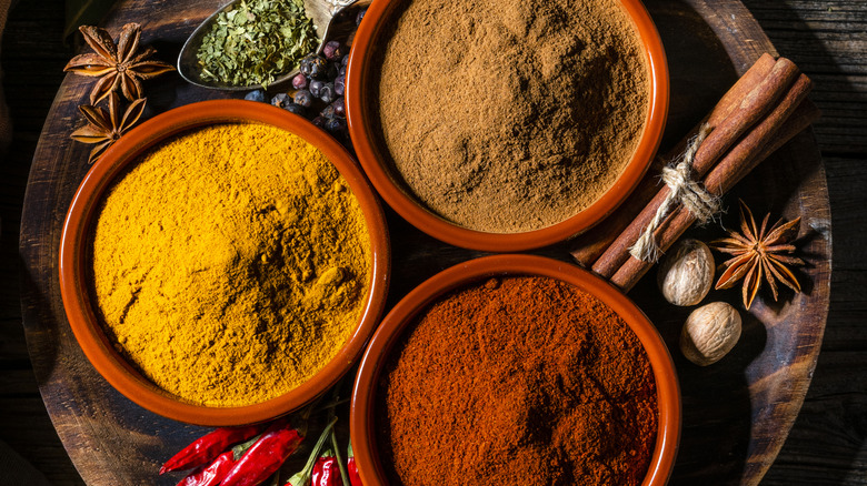 overhead shot of three ground spices in bowls