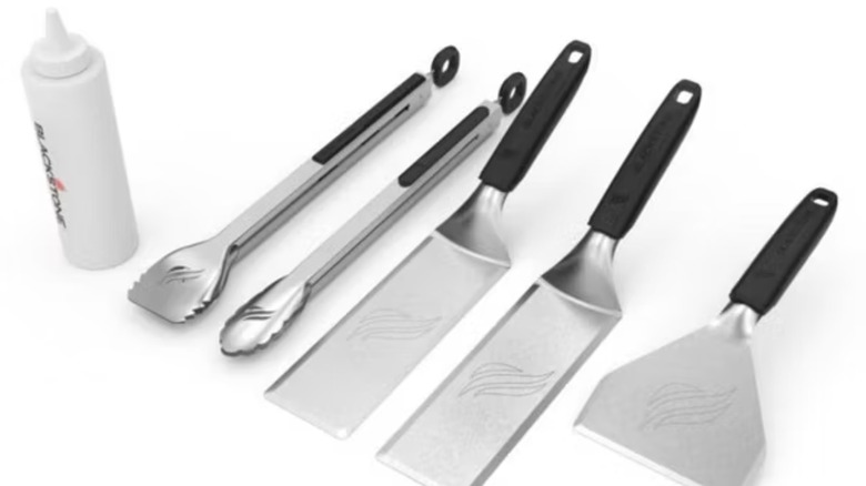 Blackstone 6-piece stainless steel silver griddle tool set with squeeze bottle, 2 tongs, two spatulas, and a scraper