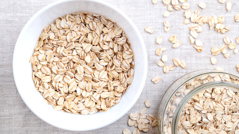 Bowl of rolled oats in a white bowl
