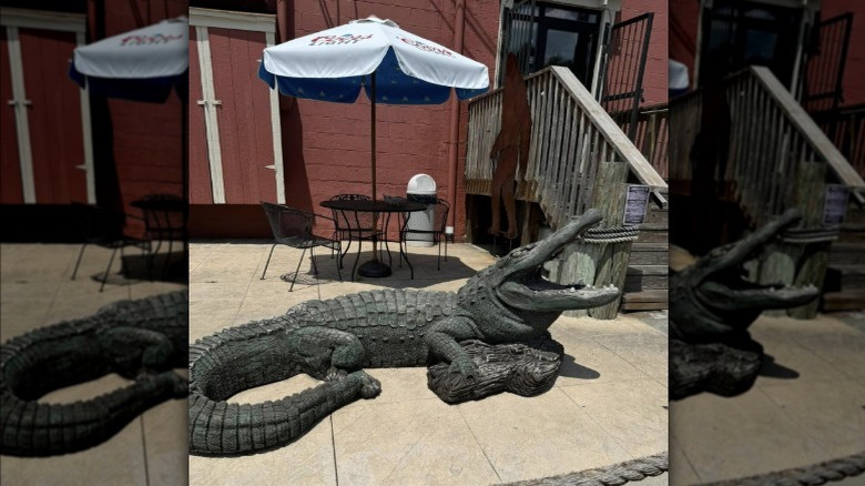 alligator statue in Swampwater Grill outdoor seating area