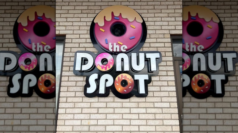 Donut Spot store sign on wall