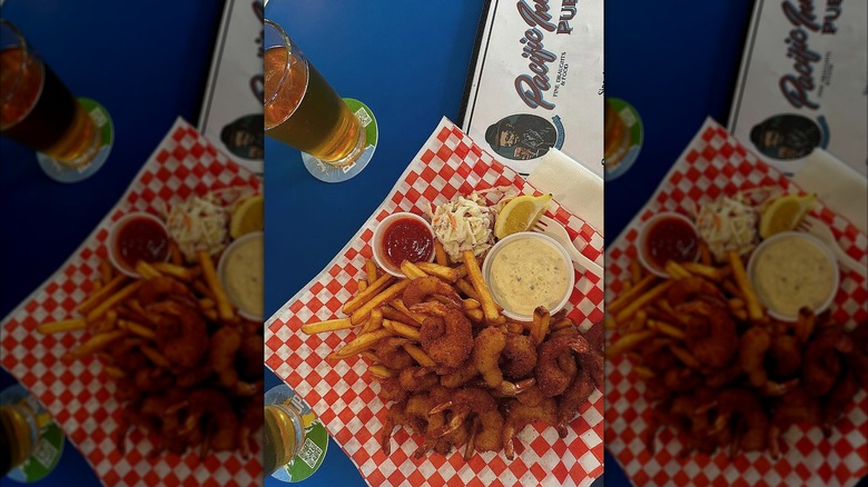 Pacific Inn fried shrimp basket on blue table