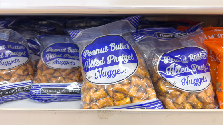 Bags of Trader Joe's Peanut Butter Filled Pretzel Nuggets on store shelf