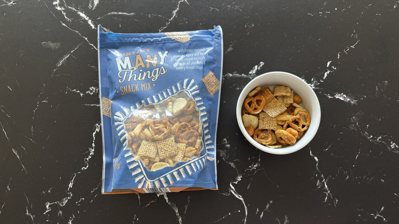 Trader Joe's Many Things snack mix next to small bowl of snack mix