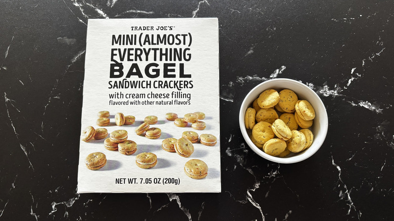 Trader Joe's mini everything bagel sandwich crackers box next to sandwich crackers in bowl