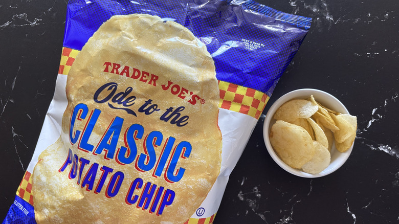 Trader Joe's ode to the classic potato chip bag next to bowl of chips