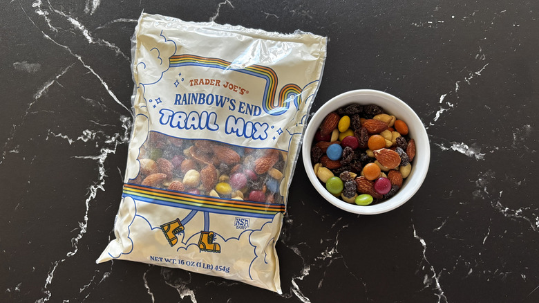 Trader Joe's rainbow's end trail mix bag next to trail mix in bowl