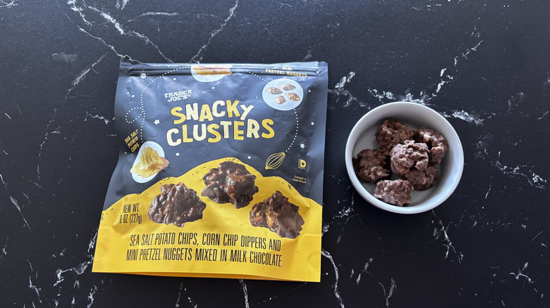 Trader Joe's snacky clusters bag next to bowl of snacky clusters