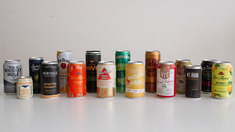 Several cans of whiskey cocktails in a row