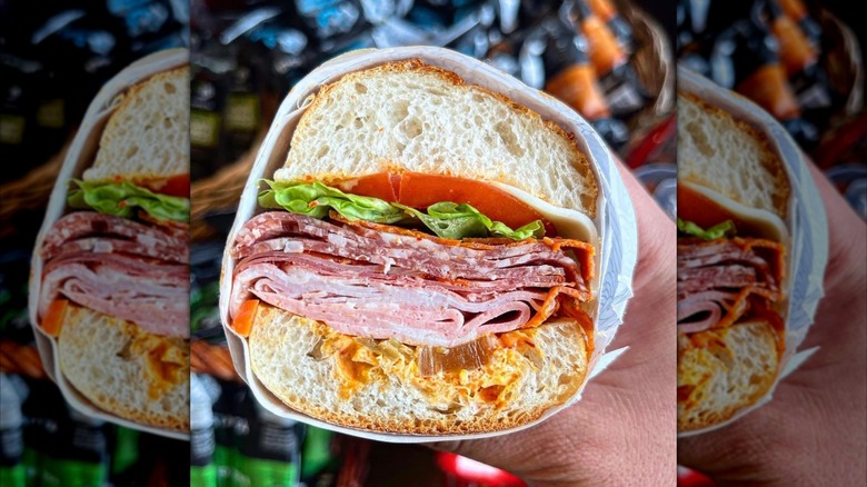 Hand holding a cross-section of The Dante sub from Tempesta Market