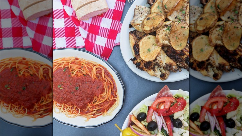 Spread with spaghetti, chicken and potatoes, and salad