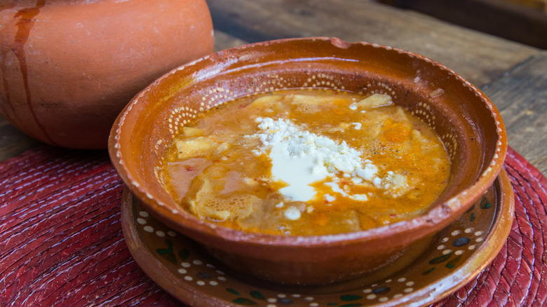 A brown bowl of Sopa Tarasca.