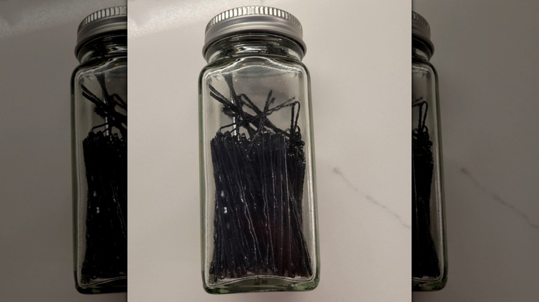 spice jar holds bobby pins.