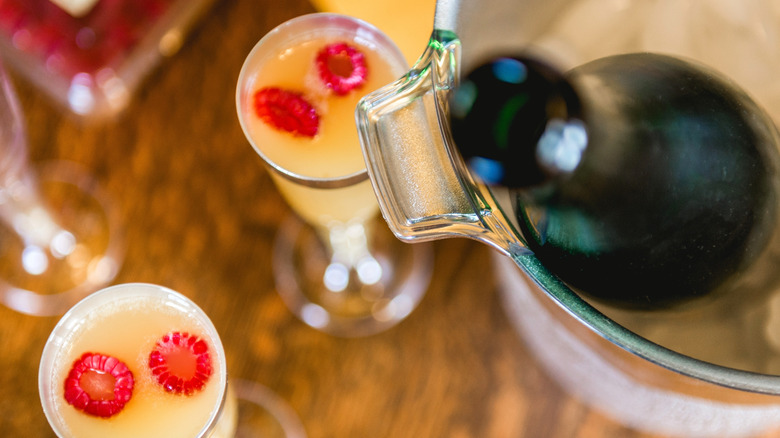Bird's eye view of mimosas with raspberries