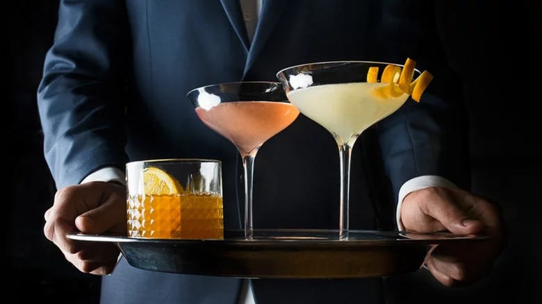 Holding tray of drinks