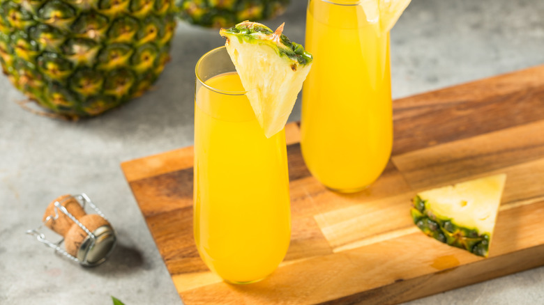 Pineapple mimosa on cutting board