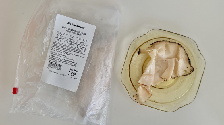 Black Pepper Turkey Breast pieces on a small plate