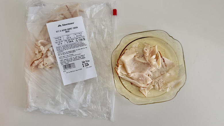 A ripped piece of Gourmet Chicken Breast on a plate