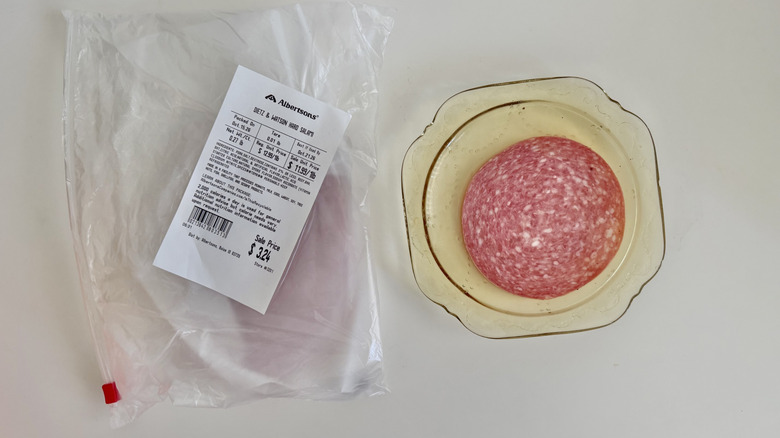One slice of salami on a plate