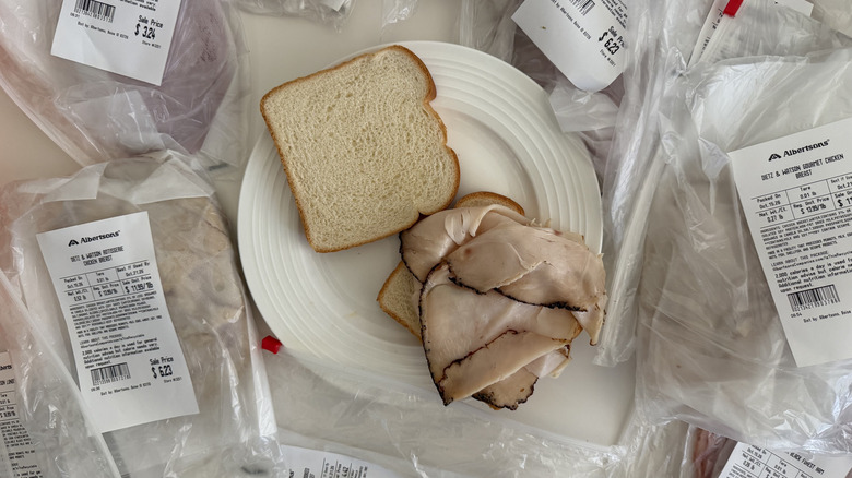 Close up of various Dietz & Watson deli meat bags with white bread