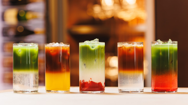 Assorted layered cocktails on the bar