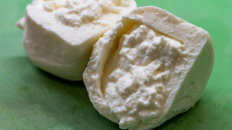 Ball of burrata sliced in half to show inside