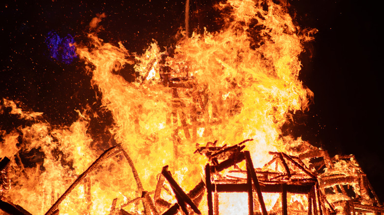 Fire destroying house
