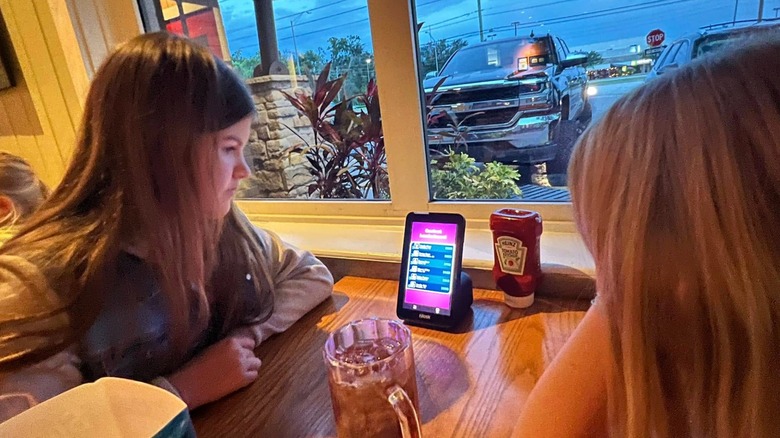 Children playing games on a tabletop tablet at Chili's