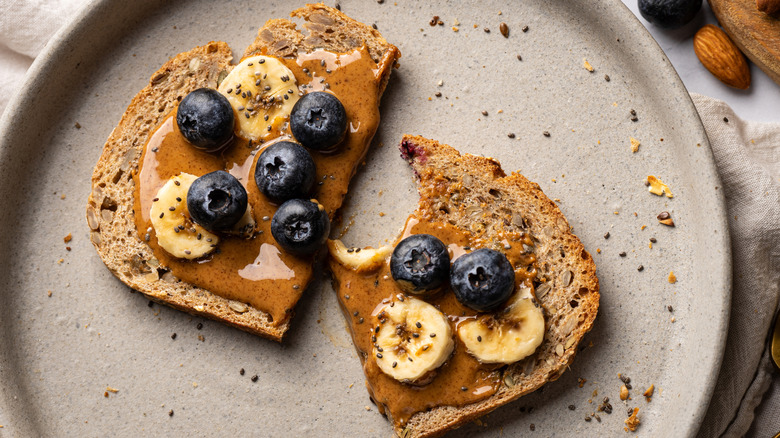 Toast with almond butter, blueberries, and bananas