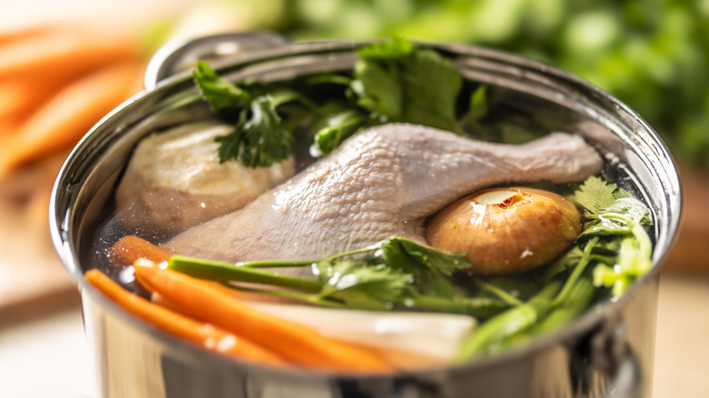 Ingredients for chicken broth in a pot