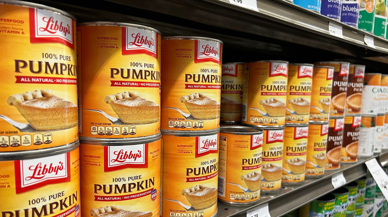 Close up of canned pumpkin on grocery store shelves