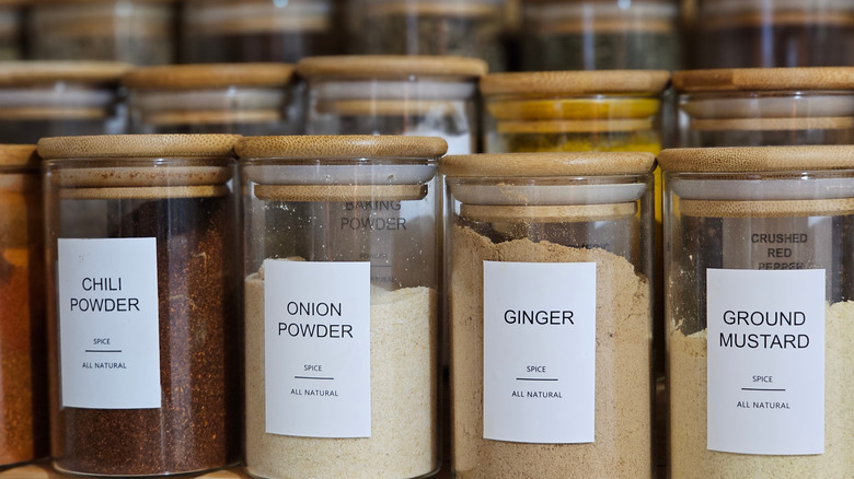 Spice rack with matching jars, labeled with the contents