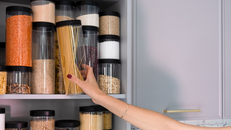 Organized pantry with matching jars with various ingredients