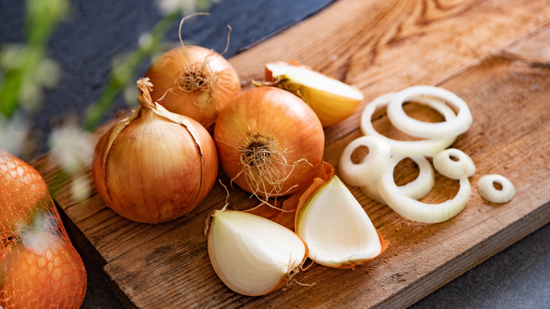Brown onions chopped on cutting board
