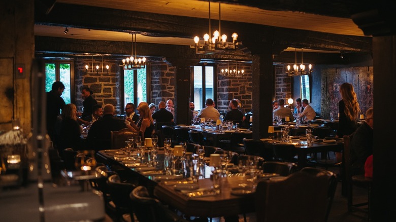 Dining area with customers at L'Auberge Saint-Gabriel
