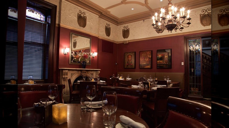 Dining room at The Keg Mansion with fireplace