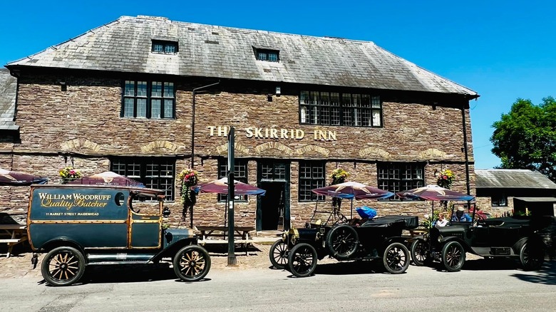 Exterior of the Skirrid Inn with old cars park in front