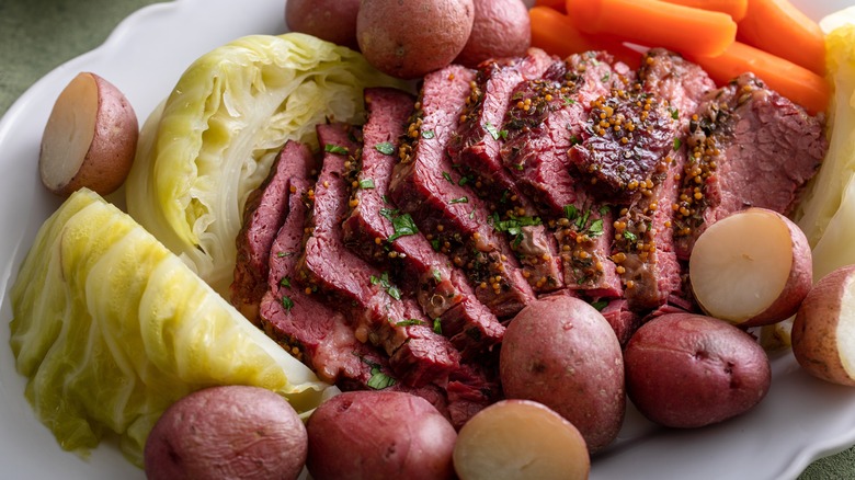 New England boiled dinner plate with corned beef, cabbage, potatoes, and carrots